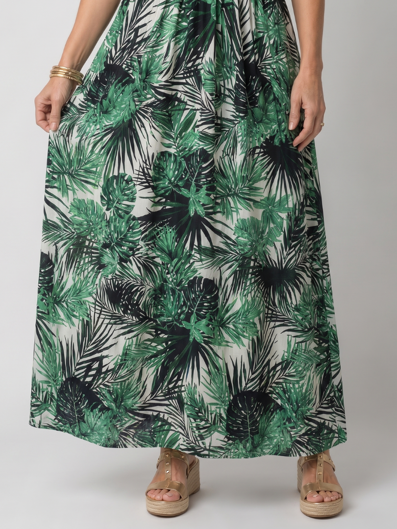 Detail of the Maravelle dress flowing palm print skirt