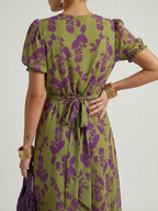 Detail of the Virel dress wrap-style bodice and floral pattern