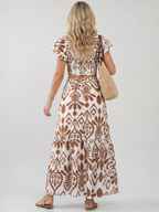 Numan printed dress with fitted bodice and flared skirt, full-length view