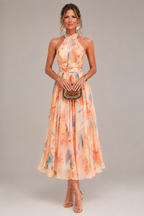 Aurora watercolor halter neck maxi dress in orange floral print, full-length front view