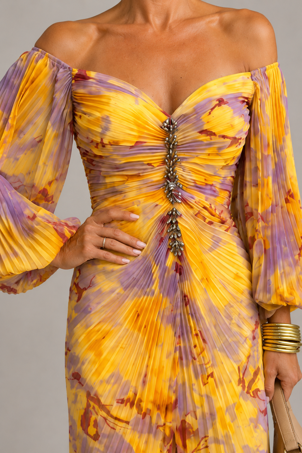 Close-up of the ruched bodice and button detail of the Mariel dress