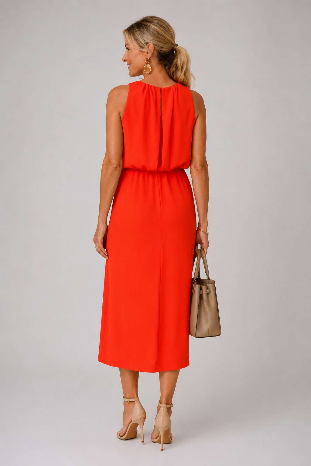 Nikki halter neck slit midi dress in orange, detail of front slit