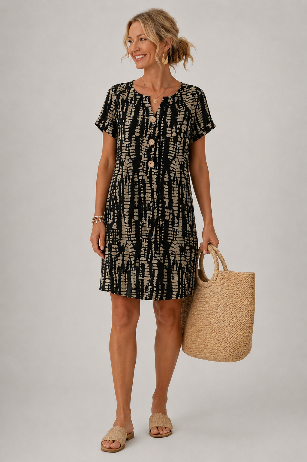Santorini printed A-line dress in black with short sleeves, knee-length front view