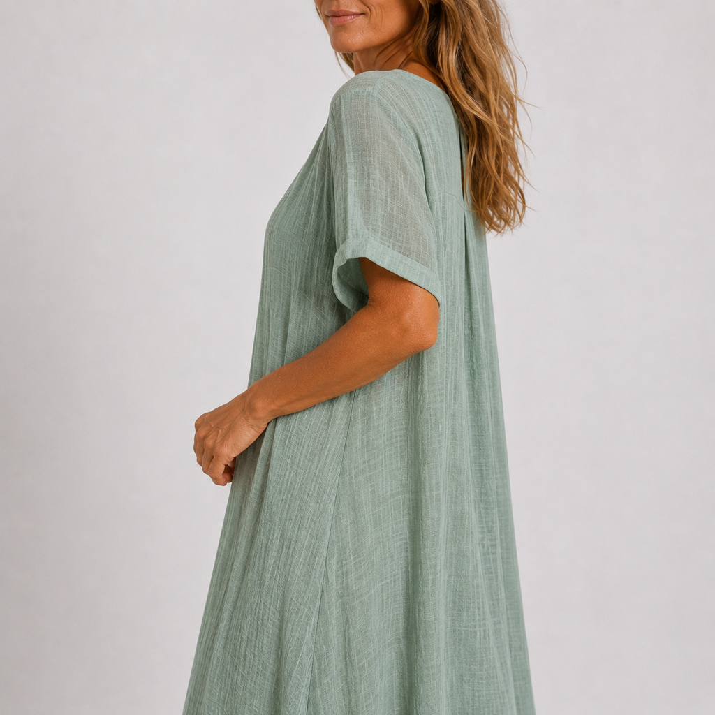 Violet flowy V-neck maxi dress in peacock green, side view
