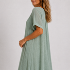 Violet flowy V-neck maxi dress in peacock green, side view