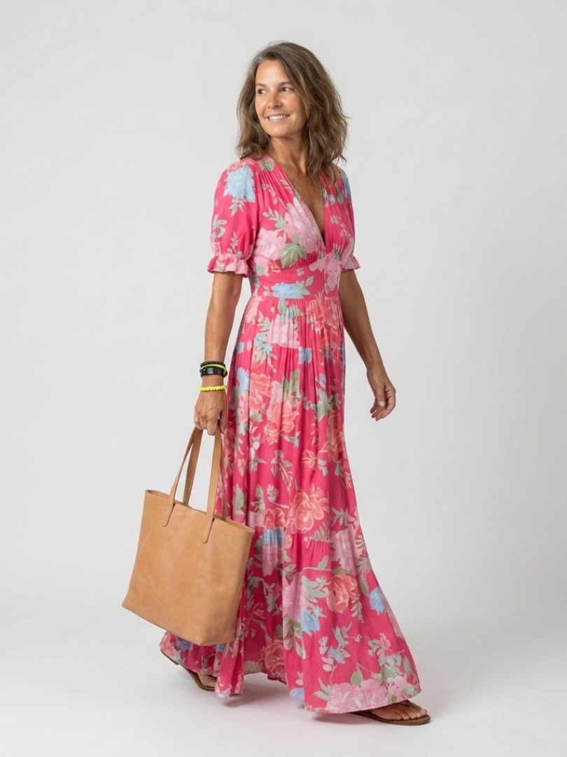 Side view of the Lone floral maxi dress showing the flowing ankle-length skirt